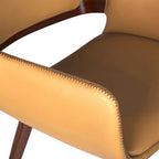 Silla de comedor de mediados de siglo de piel sintética con patas de metal